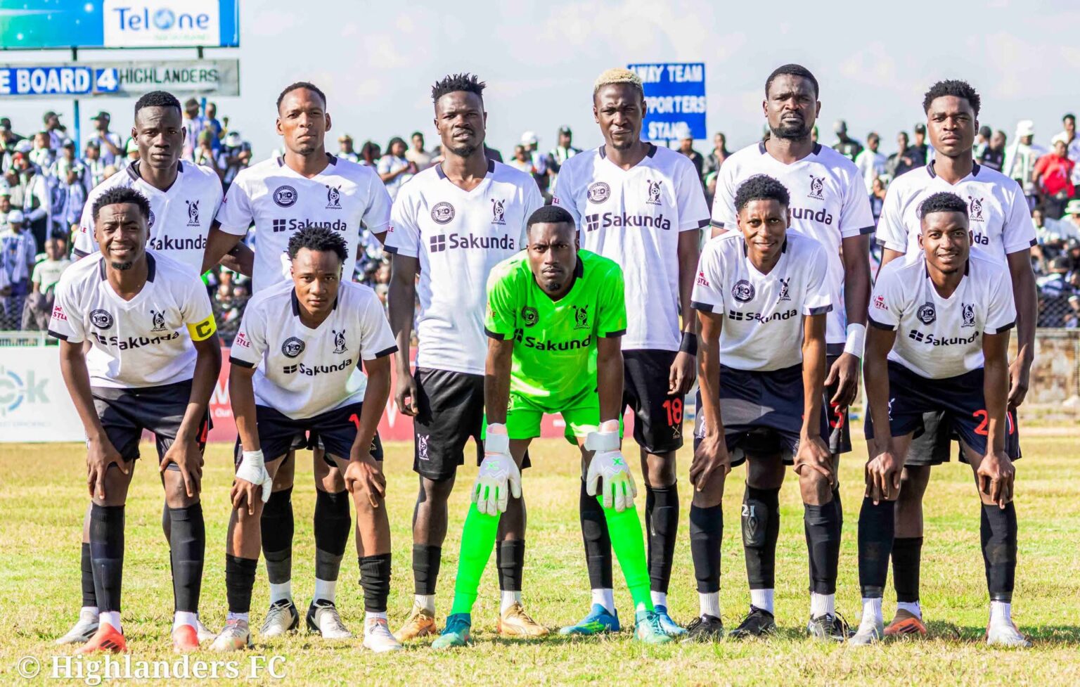Highlanders FC players pose for a photo at Ascot stadium