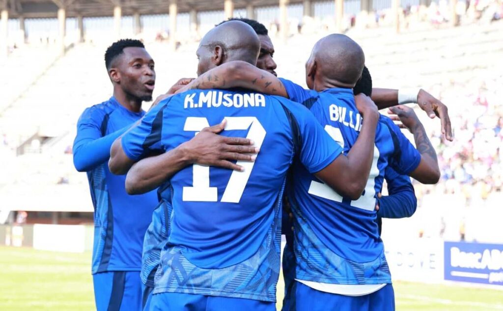 Knowledge Musona and Khama Billiat celebrating with teammates