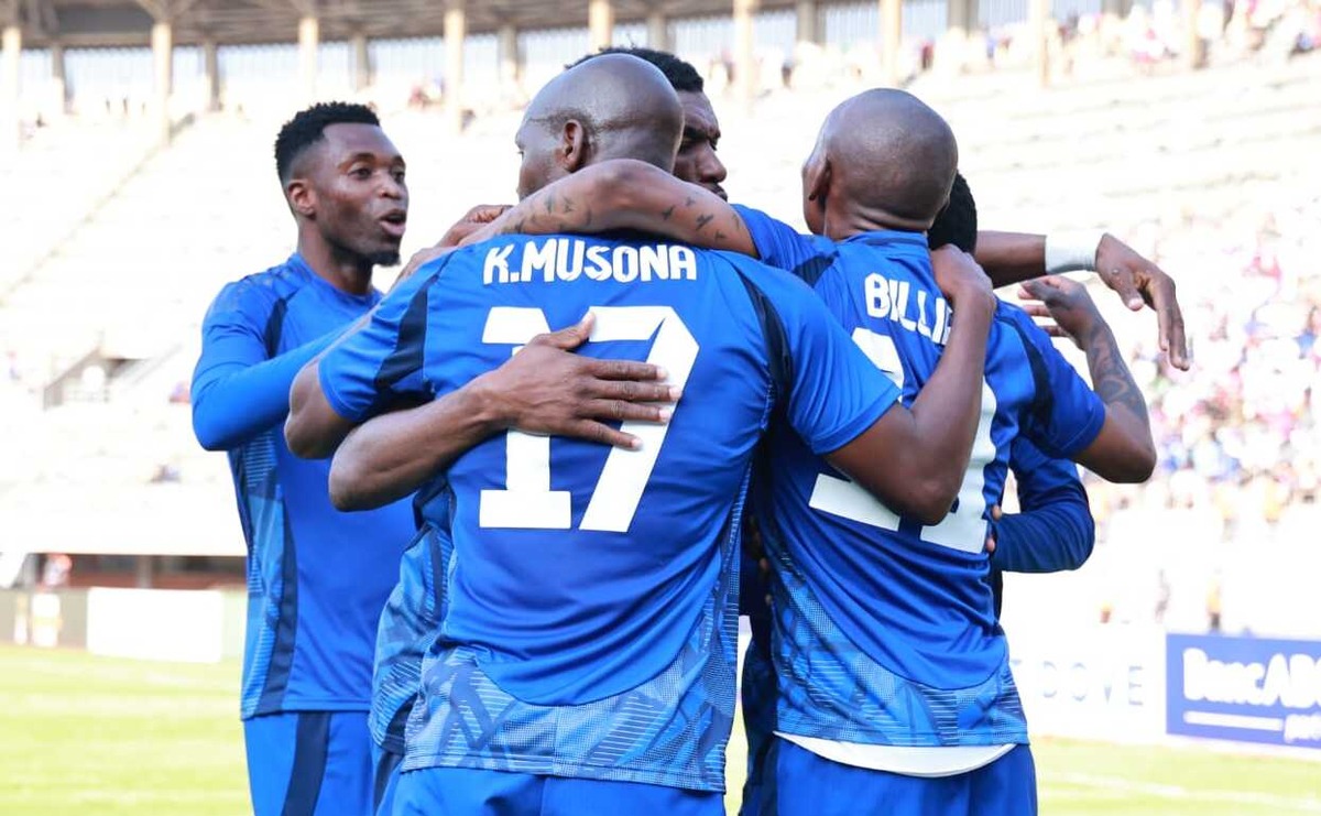 Knowledge Musona and Khama Billiat celebrating with teammates